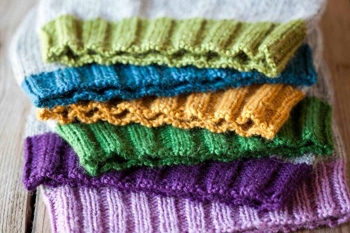 Close-up of clean reusable mop pads drying on a clothesline with eco friendly mop cleaner bottle nearby
